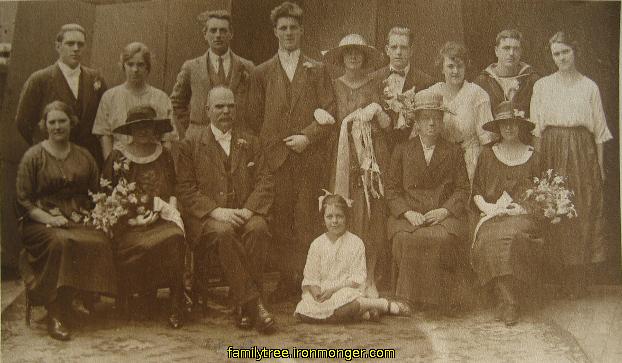 Charles Ironmonger and Minnie Moore Wedding
Back L to R Charles Moore, Hilda Moore,  ??, Charles Ironmonger, Minnie Moore, Tom Moore, Fanny Moore, John Moore, Ethel Moore Front L to R Elizabeth, ??, Charles Frederick Moore (Father), Jessie, Nellie, Dorothy Moore (Mother)